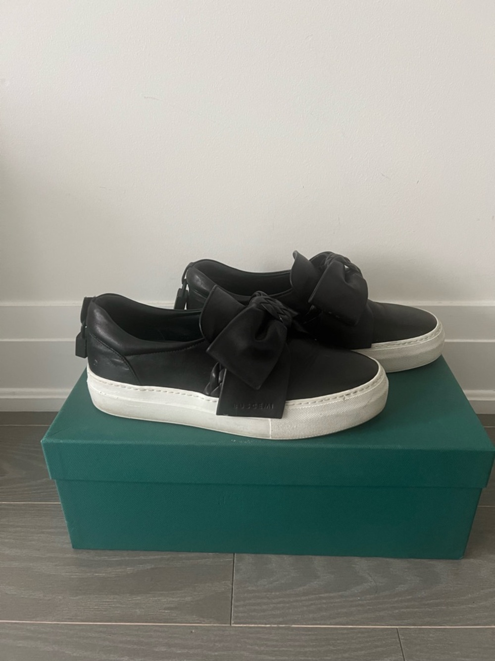 Buscemi Black Leather Slip-On Sneakers with White Platform Sole and Bow